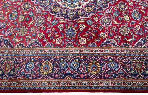 Corner detail of New Kashan rug showing border pattern and Wool pile