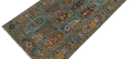 Backside of handmade New Farahan rug showing knot structure and weave density