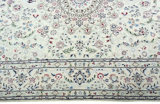 Corner detail of 2000s Nain rug showing border pattern and Wool pile
