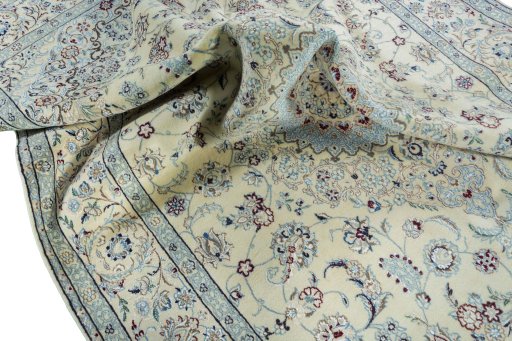 Surface texture of 2000s Nain rug with natural Wool and intricate pattern