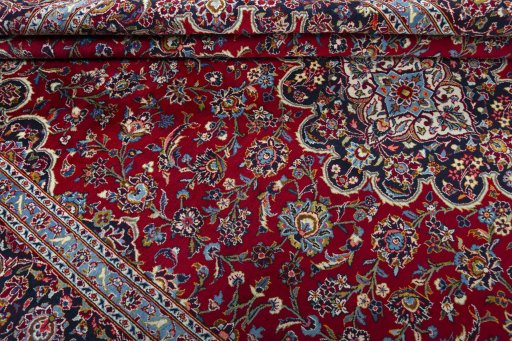 Close-up detail of 2000s Kashan rug from Iran / Persia showing Wool weave