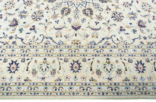 Corner detail of New Kashan rug showing border pattern and Wool pile