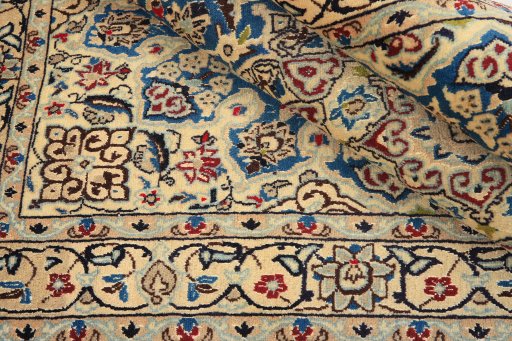Corner detail of 1990s Nain Silk rug showing border pattern and Wool pile