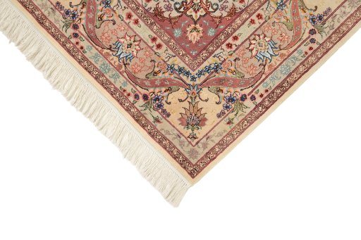 Backside of handmade New Tabriz Silk rug showing knot structure and weave density