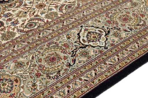 Backside of handmade New Tabriz Silk rug showing knot structure and weave density