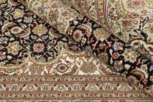 Central medallion detail of New Tabriz Silk rug from Iran / Persia