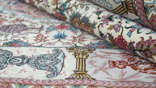 Close-up detail of New Tabriz Silk rug from Iran / Persia showing Wool weave