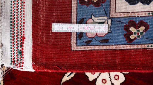 Close-up detail of New Tabriz Silk rug from Iran / Persia showing Silk weave