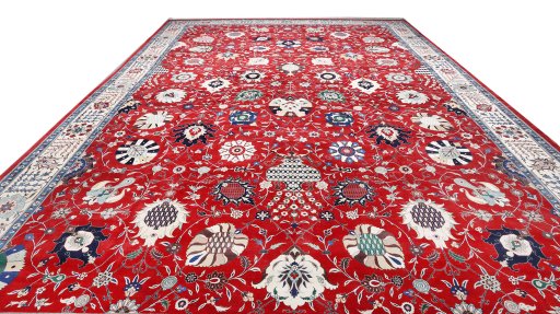 Backside of handmade New Tabriz Silk rug showing knot structure and weave density