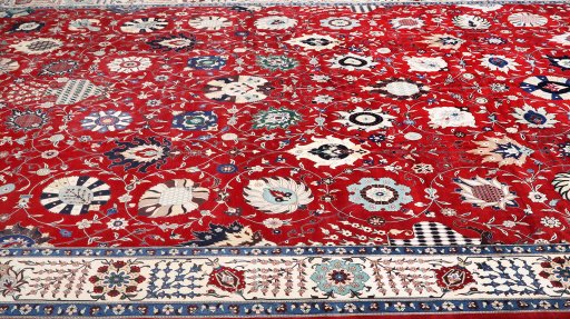 Central medallion detail of New Tabriz Silk rug from Iran / Persia