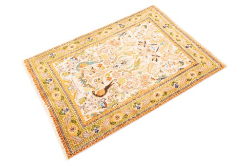 Corner detail of 2000s Tabriz Silk rug showing border pattern and Wool pile