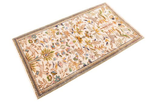 Corner detail of 2005s Tabriz Silk rug showing border pattern and Wool pile