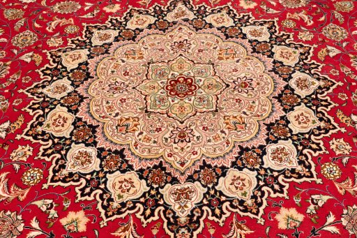 Corner detail of 2020s Tabriz Silk rug showing border pattern and Wool pile