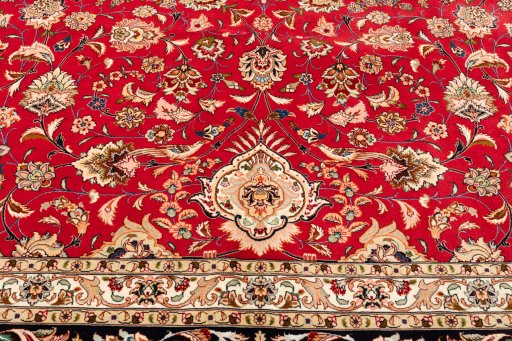 Surface texture of 2020s Tabriz Silk rug with natural Wool and intricate pattern