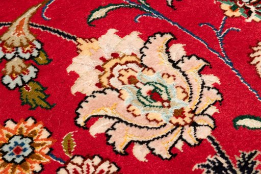 Close-up detail of 2020s Tabriz Silk rug from Iran / Persia showing Wool weave