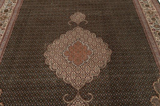 Corner detail of 2019s Tabriz Silk rug showing border pattern and Wool pile