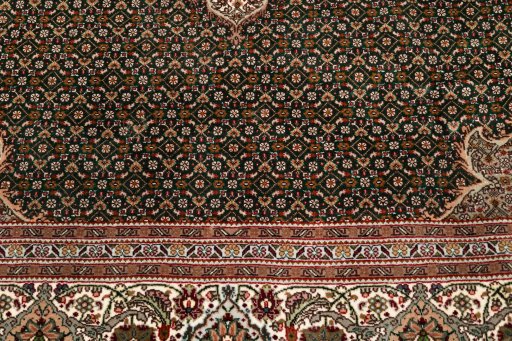 Surface texture of 2019s Tabriz Silk rug with natural Wool and intricate pattern