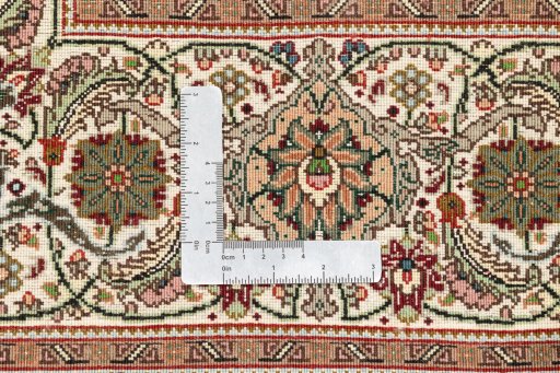 Close-up detail of 2019s Tabriz Silk rug from Iran / Persia showing Wool weave