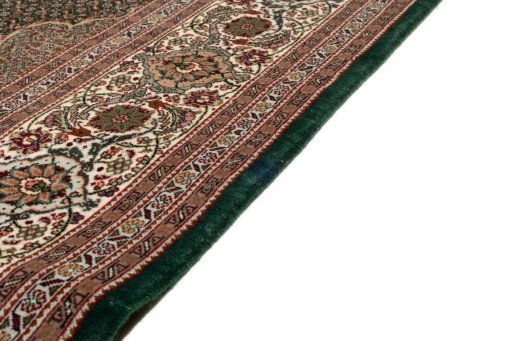Close-up detail of 2019s Tabriz Silk rug from Iran / Persia showing Wool weave