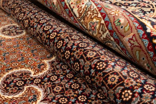 Close-up detail of 2020s Tabriz Silk rug from Iran / Persia showing Wool weave