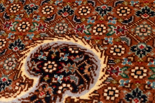 Surface texture of 2020s Tabriz Silk rug with natural Wool and intricate pattern