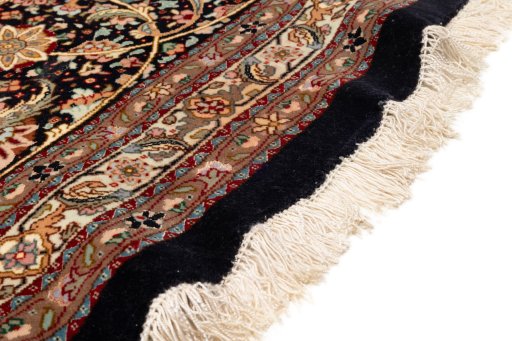 Close-up detail of 2020s Tabriz Silk rug from Iran / Persia showing Wool weave