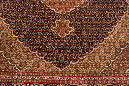 Corner detail of 2018s Tabriz Silk rug showing border pattern and Wool pile