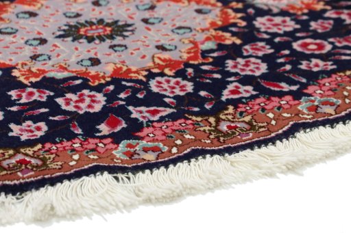 Backside of handmade New Tabriz Silk rug showing knot structure and weave density