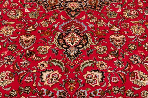 Corner detail of New Tabriz Silk rug showing border pattern and Wool pile