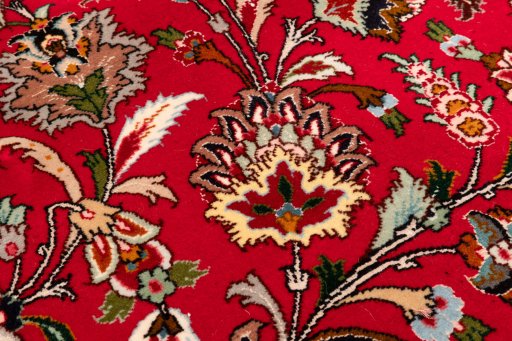 Backside of handmade New Tabriz Silk rug showing knot structure and weave density