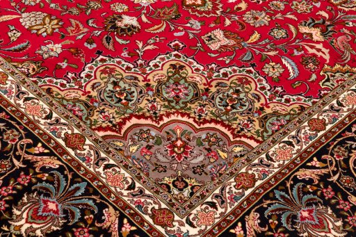 Backside of handmade New Tabriz Silk rug showing knot structure and weave density