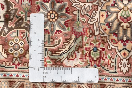 Close-up detail of New Tabriz Silk rug from Iran / Persia showing Wool weave