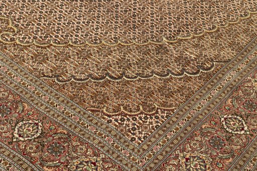 Backside of handmade New Tabriz Silk rug showing knot structure and weave density
