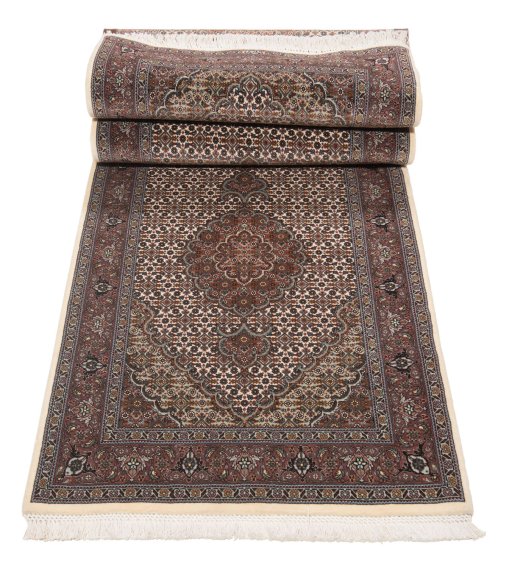 Close-up detail of New Tabriz Silk rug from Iran / Persia showing Wool weave
