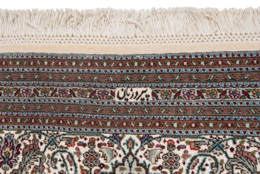 Corner detail of New Tabriz Silk rug showing border pattern and Wool pile