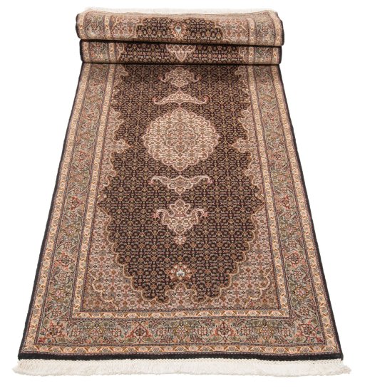 Close-up detail of New Tabriz Silk rug from Iran / Persia showing Wool weave