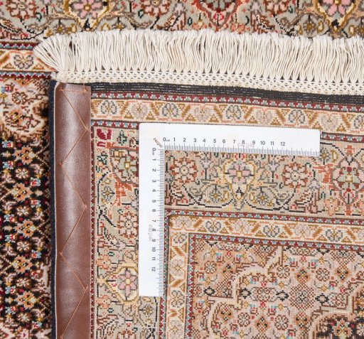 Surface texture of New Tabriz Silk rug with natural Wool and intricate pattern