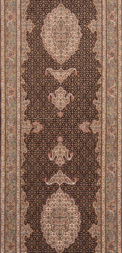 Corner detail of New Tabriz Silk rug showing border pattern and Wool pile
