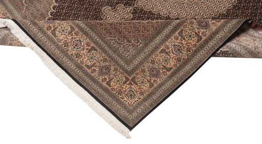 Backside of handmade New Tabriz Silk rug showing knot structure and weave density