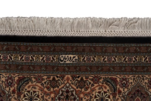 Close-up detail of New Tabriz Silk rug from Iran / Persia showing Wool weave