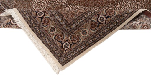 Backside of handmade New Tabriz Silk rug showing knot structure and weave density