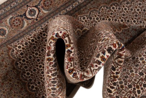 Surface texture of New Tabriz Silk rug with natural Wool and intricate pattern