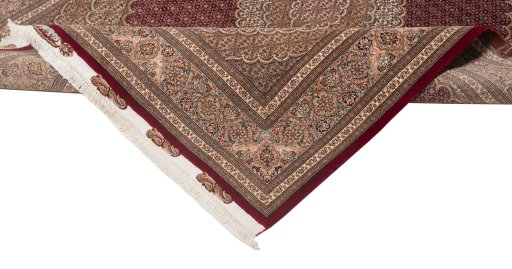 Backside of handmade New Tabriz Silk rug showing knot structure and weave density