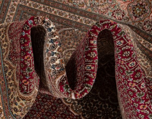 Surface texture of New Tabriz Silk rug with natural Wool and intricate pattern