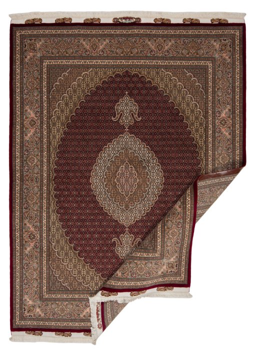 Central medallion detail of New Tabriz Silk rug from Iran / Persia