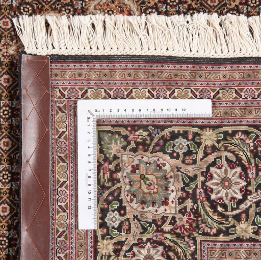 Backside of handmade New Tabriz Silk rug showing knot structure and weave density