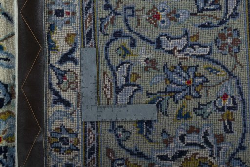 Backside of handmade 2000s Kashan rug showing knot structure and weave density