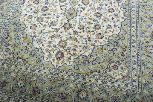 Close-up detail of 2000s Kashan rug from Iran / Persia showing Wool weave