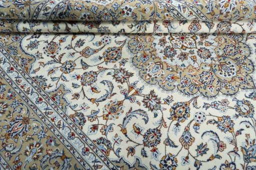 Close-up detail of 2000s Kashan rug from Iran / Persia showing Wool weave