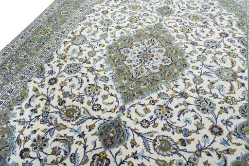 Backside of handmade 2000s Kashan rug showing knot structure and weave density